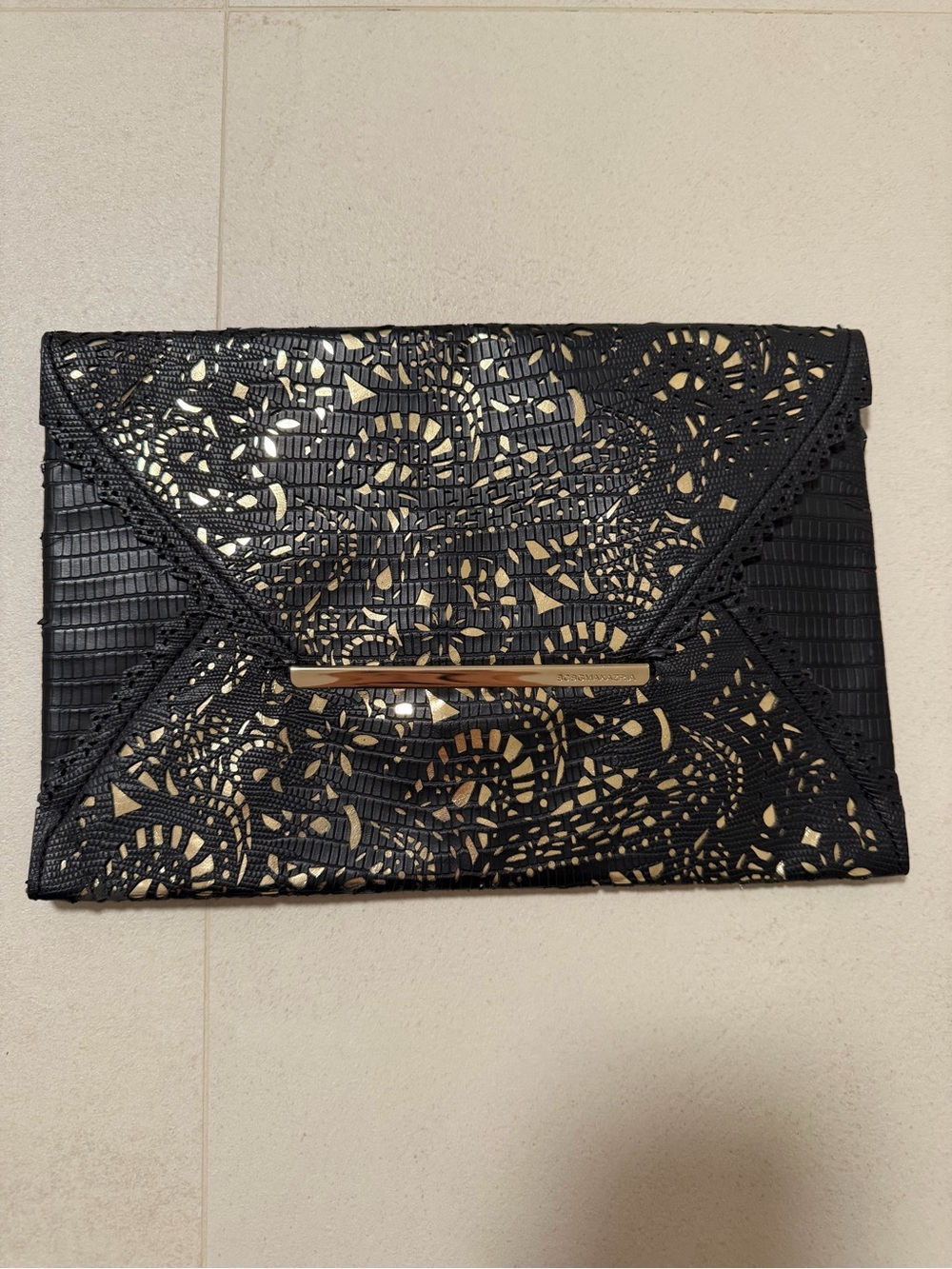 Black and Gold BCBG Lace-Pattern Envelope Clutch